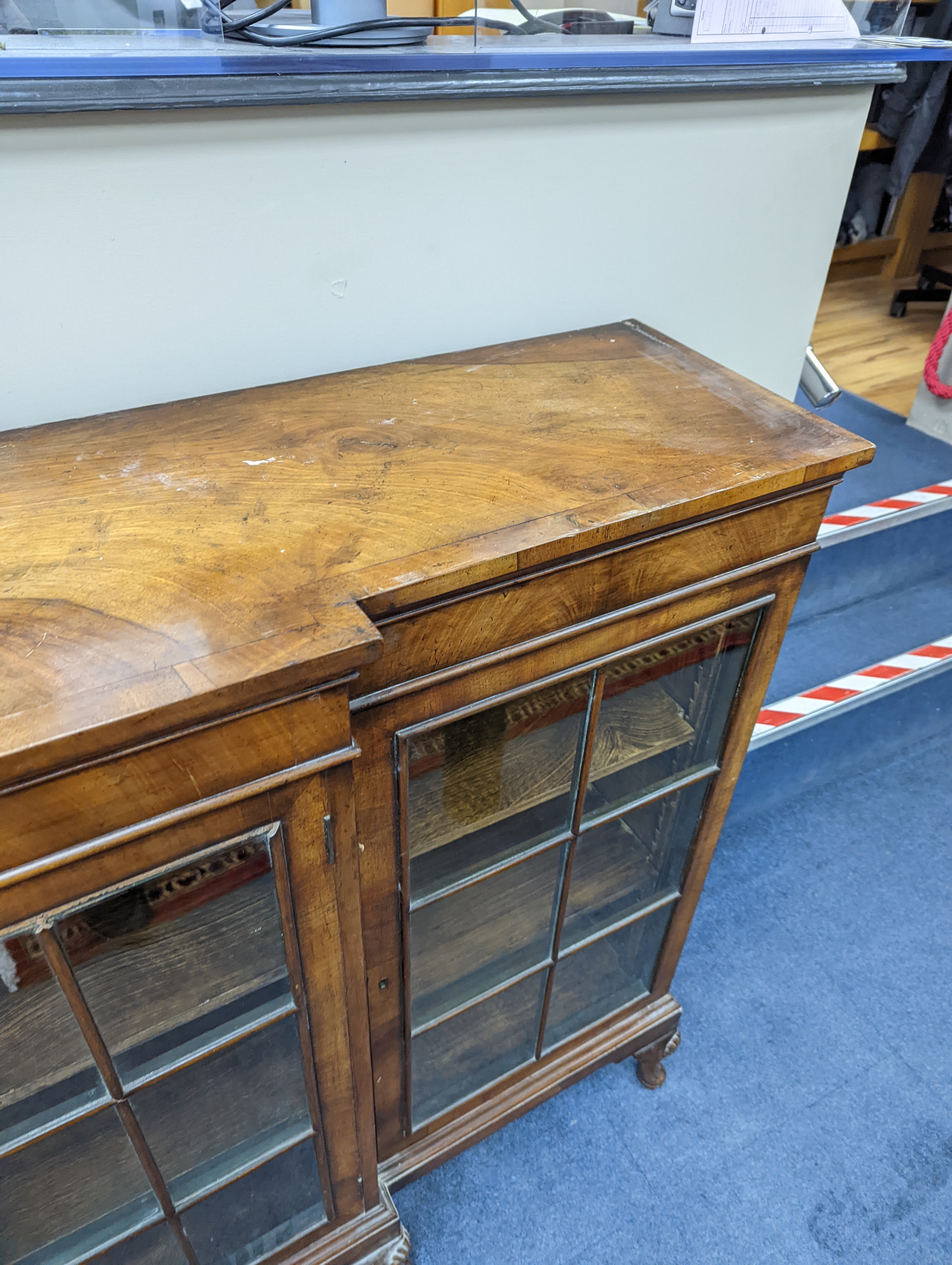 A Queen Anne revival walnut dwarf breakfront bookcase, length 182cm, depth 38cm, height 113cm